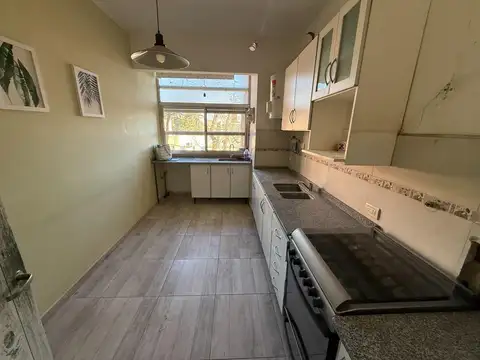 Departamento tres dormitorios con cochera