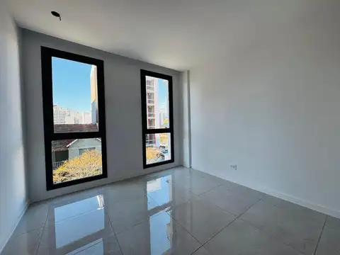 Departamento de tres ambientes a estrenar con cochera privada en Castelli 1900