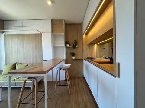 Alquiler - Monoambiente amoblado y reciclado en piso 8, balcón y vista despejada en Barrio Lourdes