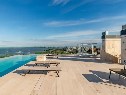 EXCLUSIVO 3 AMBIENTES A ESTRENAR CON BALCÓN, VISTA LATERAL AL RÍO Y EXCELENTE COCHERA – TORRE SELENE