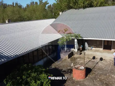 Chacra de 9 hectáreas con múltiples construcciones