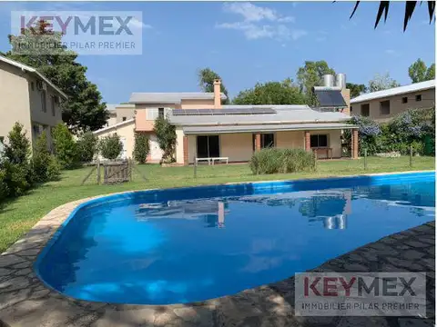 CASA dúplex  VENTA PILAR KM 50 DE 2 DORMITORIOS con jardin y parrilla seguridad pileta