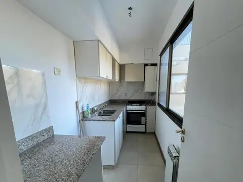 Departamento 1 dormitorio con cochera en alquiler