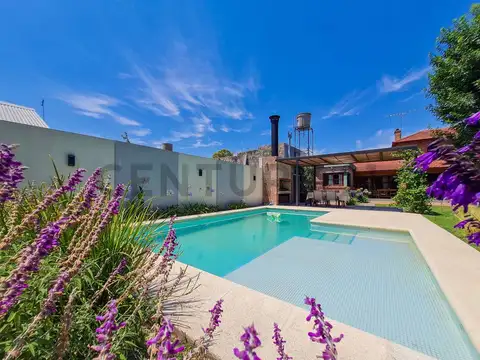 Casa de 4 dormitorios con parque y pileta