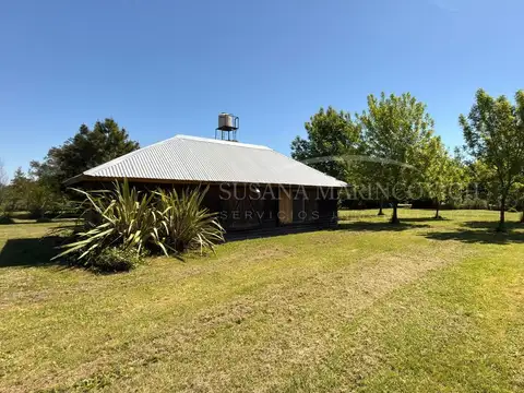 Terreno de Azcuenaga con cabaña y taller