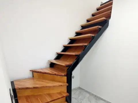 CASA A ESTRENAR DE DOS DORMITORIOS CON GARAGE. TOTALMENTE ELECTRICA