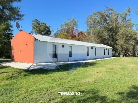 Chacra de 9 hectáreas con múltiples construcciones