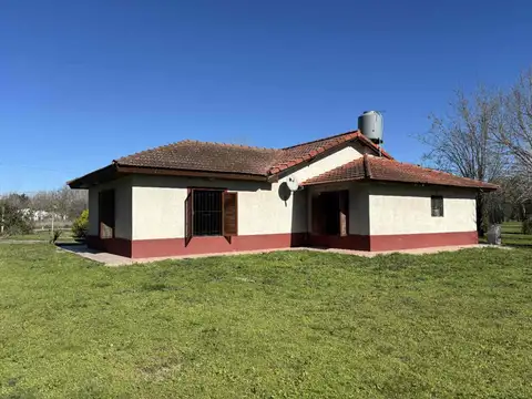 CAMPO EN VENTA EN ABASTO CON CASA Y LOCAL