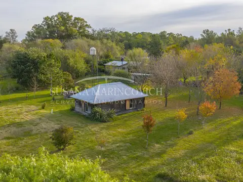 Terreno de Azcuenaga con cabaña y taller