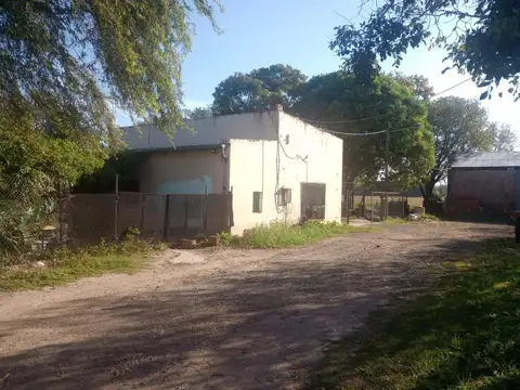 Venta Terreno con construcción camino a San Carlos